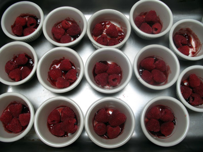 Jam and Raspberry covered cups ready for custard 