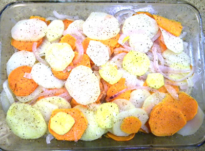 sliced potatoes and onions before liquid and cheese is added