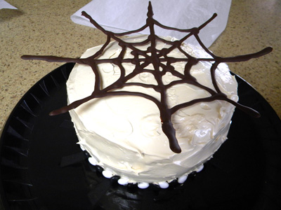 web placed on cake, allow to soften before pressing down.