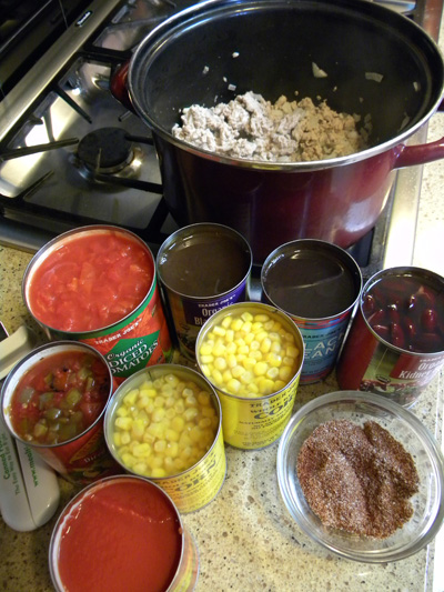 cooked ground turkey, ready for seasoning, beans and vegetables