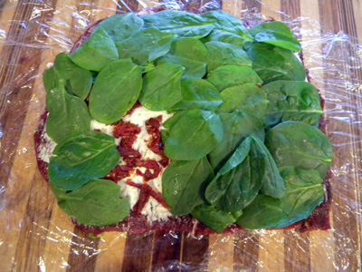 pounded out and layered with garlic, cheese spread, tomatoes and spinach