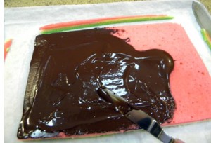rough edges trimmed and spreading with melted chocolate