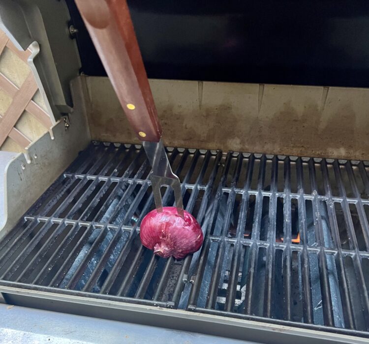 Why You Should Use An Onion To Clean Your Grill